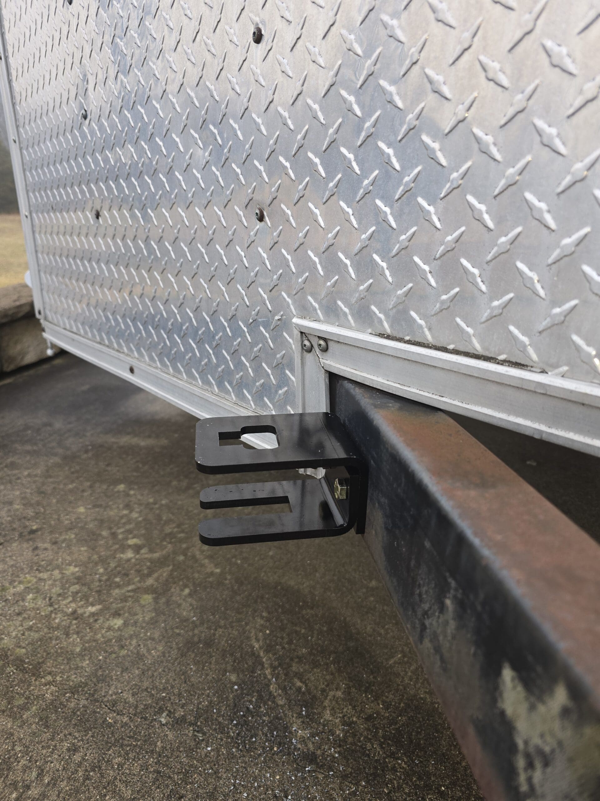 Trailer coupler lock storage bracket
