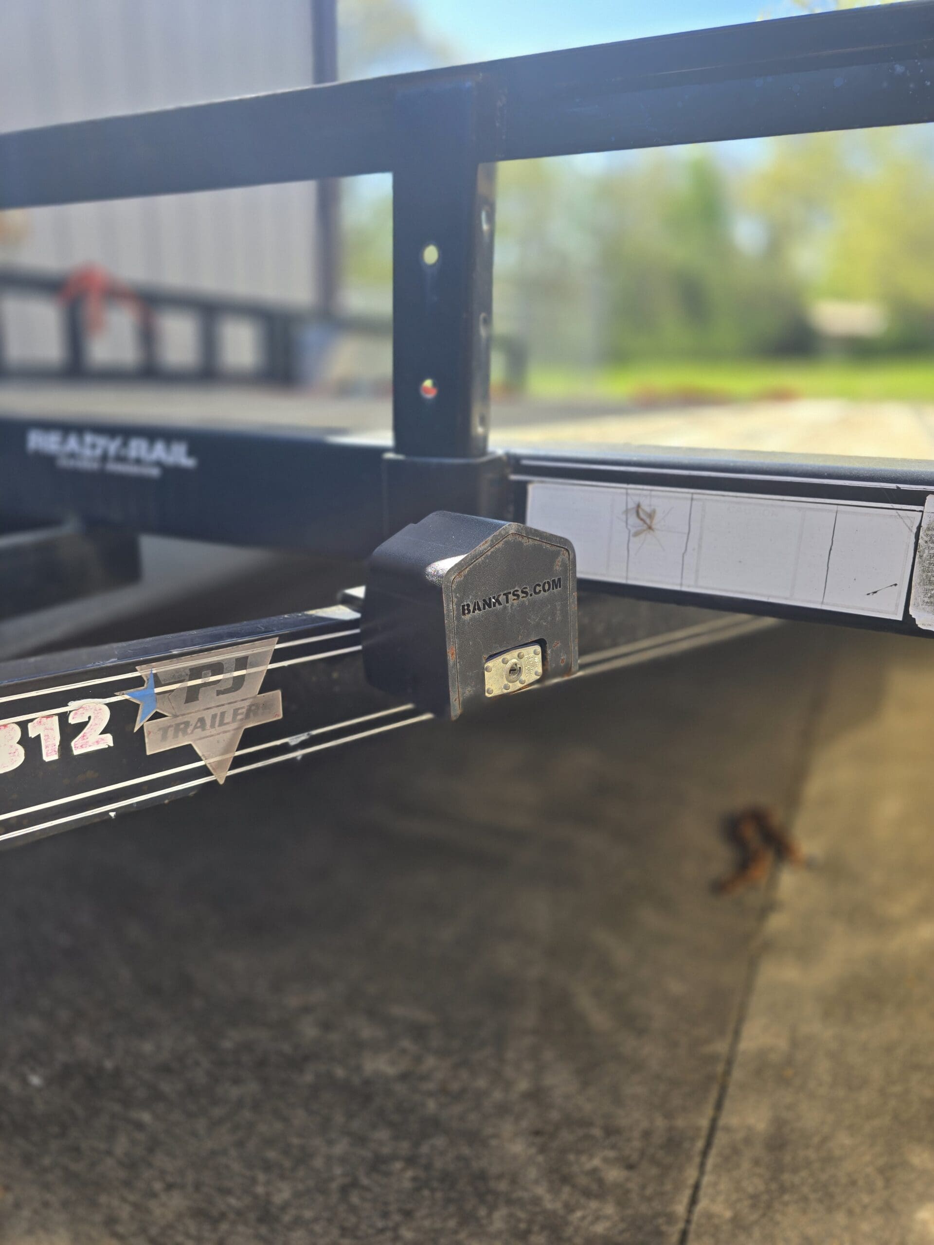 Trailer coupler lock on the storage bracket